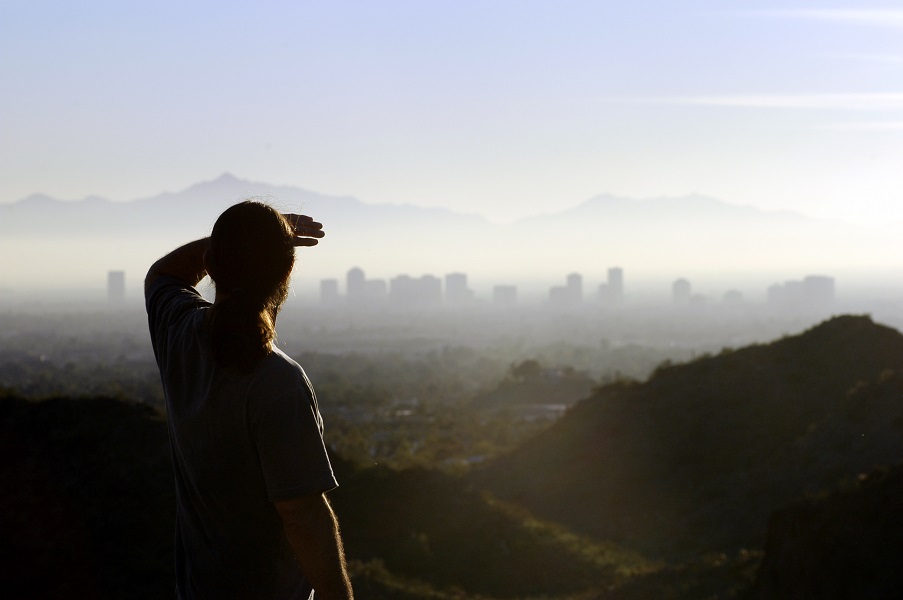 Man,Looking,At,Distant,City
